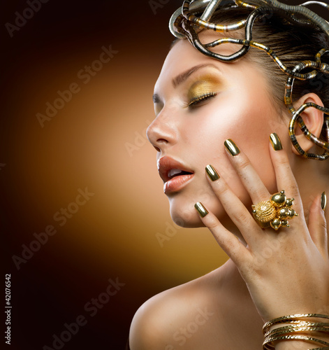 Photo: Golden Makeup. Fashion Girl Portrait Golden Makeup. Fashion Girl Portrait