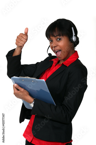 Photo: Call centre supervisor giving the thumb's up Call centre supervisor giving the thumb's up