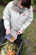 Woman making a compost