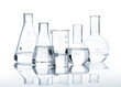 Photo: Five glass flasks with a clear liquid Five glass flasks with a clear liquid