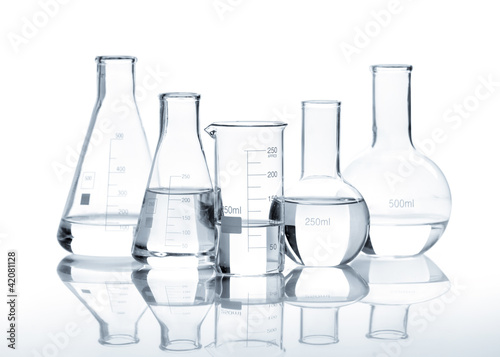 Photo: Five glass flasks with a clear liquid Five glass flasks with a clear liquid