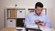 Video: Business man at his desk browing the internet with smartphone Business man at his desk browing the internet with smartphone