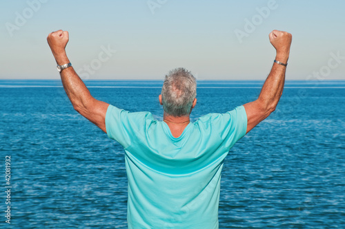 Photo: Man with a gesture of success Man with a gesture of success