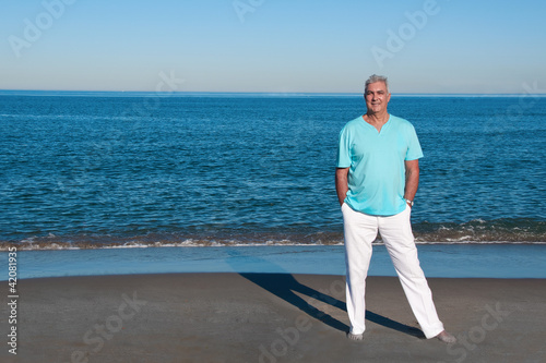 Photo: Relaxed mature man at the beach Relaxed mature man at the beach