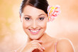 portrait of young smiley woman against blurred background