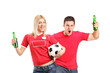 Male and female euphoric fans holding beer bottles and football