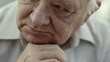 Portrait of sad bald senior man looking at camera
