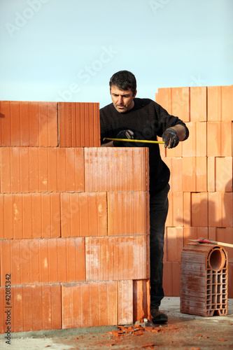 Photo: Man working alone on site Man working alone on site
