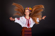 Portrait of a beautiful girl with flying brown hair. Woman wears