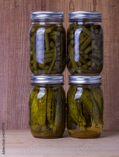Photo: Beans and pickles preserved in mason jars Beans and pickles preserved in mason jars