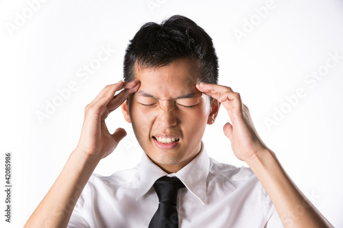 Photo: Man holding his head in distress Man holding his head in distress