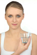 Young woman with a glass of water