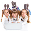 Photo: Three attractive girl using a laptop Three attractive girl using a laptop