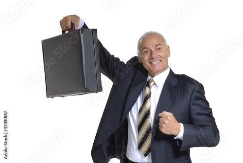 Photo: Señor ejecutivo sosteniendo un maletín. Señor ejecutivo sosteniendo un maletín.