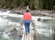 Obese woman on a suspension bridge