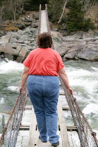 Photo: Obese woman on suspension bridge Obese woman on suspension bridge