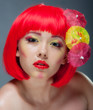 Foto: Pretty girl with red lips and colourful makeup Pretty girl with red lips and colourful makeup