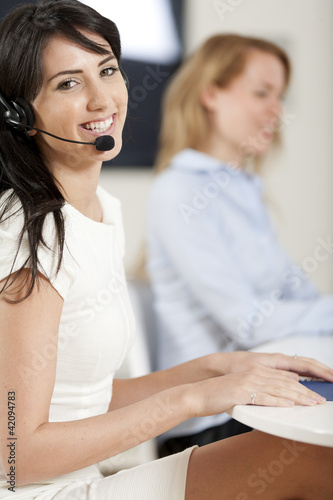Photo: Women in a busy call centre Women in a busy call centre