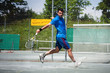 Foto: Tennisspieler bei der Rückhand Tennisspieler bei der Rückhand