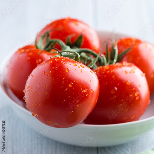 Photo: Fresh tomatoes in a white bowl Fresh tomatoes in a white bowl