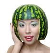 Funny woman with water-melon as helmet