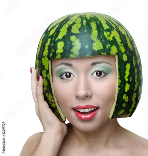 Foto: Funny woman with water-melon as helmet Funny woman with water-melon as helmet