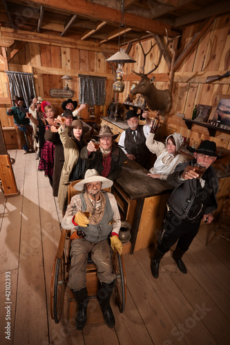 Photo: Customers in Old Saloon Toasting Drinks Customers in Old Saloon Toasting Drinks