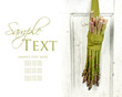 Bunch of asparagus hanging on a door