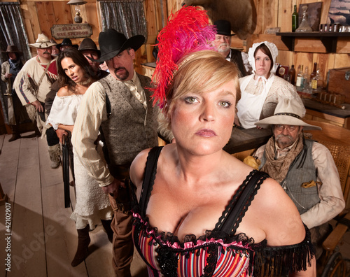 Photo: Serious Group of People in Old Saloon Serious Group of People in Old Saloon