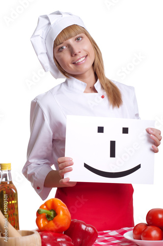 Photo: Attractive cook woman a over white background Attractive cook woman a over white background