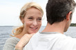 Happy woman relaxing on husband's shoulder