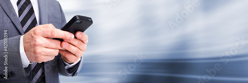 Photo: Businessman calling by phone. Businessman calling by phone.