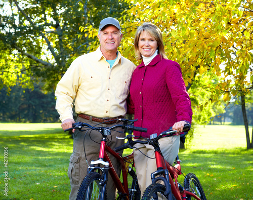 Photo: Senior couple cycling Senior couple cycling