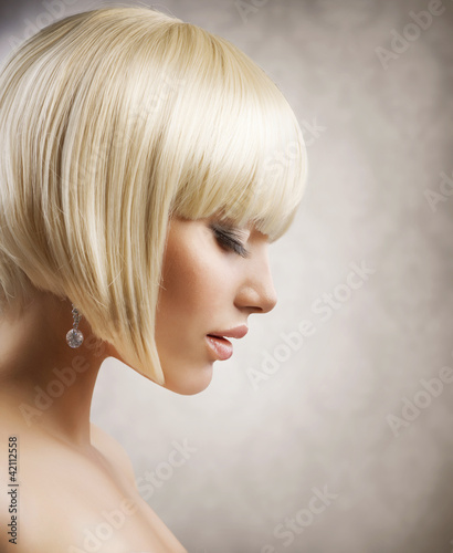 Photo: Haircut. Beautiful Girl with Healthy Short Blond Hair. Hairstyle Haircut. Beautiful Girl with Healthy Short Blond Hair. Hairstyle