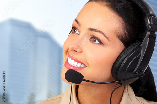 Photo: Call center operator woman. Call center operator woman.
