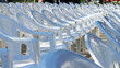 Array of empty white chairs