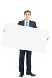 Happy smiling young business man showing blank