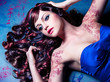 closeup of model with beautiful curly colored hair / haircolors