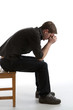worried man sitting alone