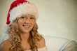 Portrait of a beautiful young woman in santa hat