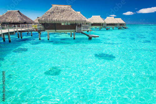 Photo: Water villas in the ocean with steps into lagoon Water villas in the ocean with steps into lagoon