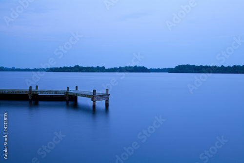 Photo: wooden pier on the lake at night wooden pier on the lake at night