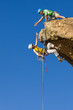 Climbing team struggles to the summit.