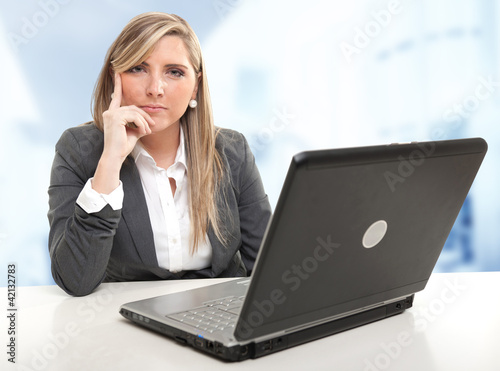 Photo: Serious attentive business woman Serious attentive business woman