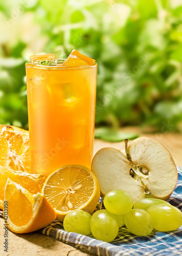 Photo: Juice, orange, apple, grape and lemon, outdoor Juice, orange, apple, grape and lemon, outdoor