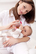 Baby girl held by her mother