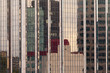 Reflections in modern glass-walled building facade