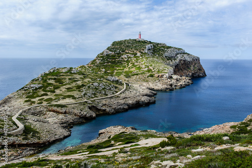 Photo: Cabrera island. Old lighthouse on the rock cape. Cabrera island. Old lighthouse on the rock cape.