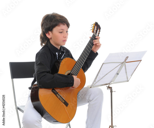Photo: Little boy musician playing guitar Little boy musician playing guitar
