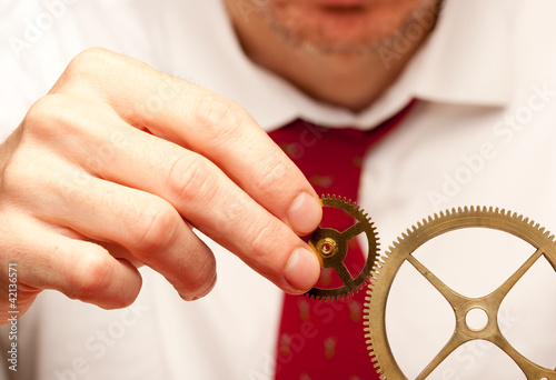 Photo: holding cogwheels holding cogwheels